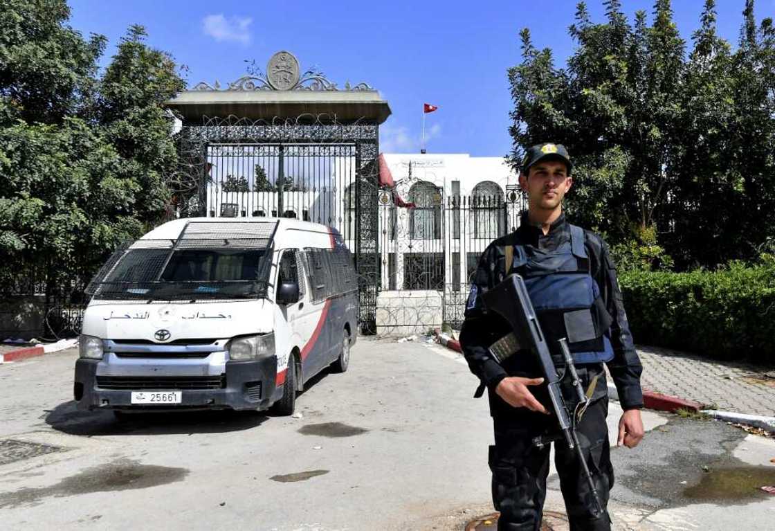 A Tunisian security guard stands guard outside parliament in Tunis on March 31, 2022 A Tunisian security guard stands guard outside parliament in Tunis on March 31, 2022
