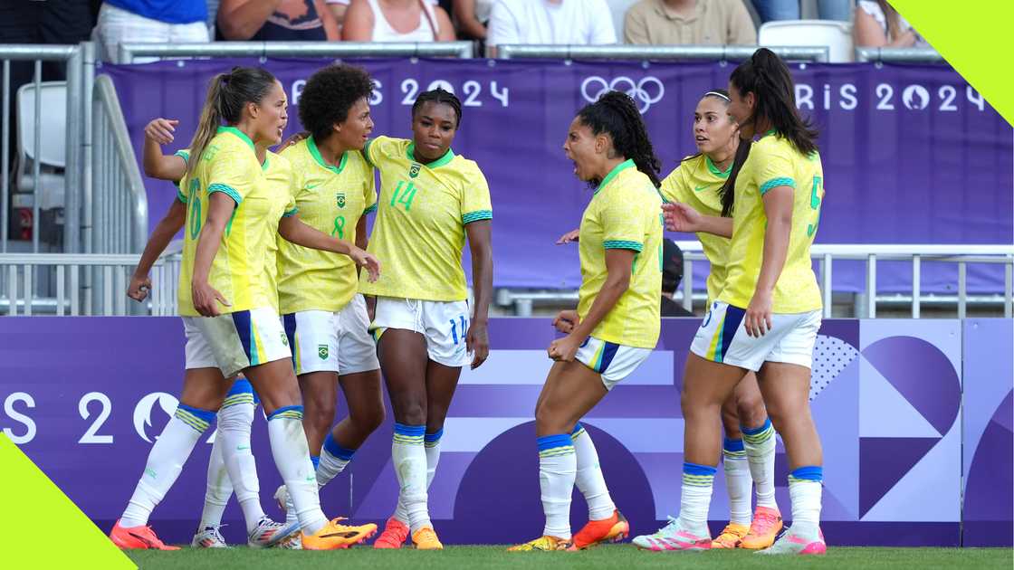 Brazil players celebrate their goal against Nigeria.