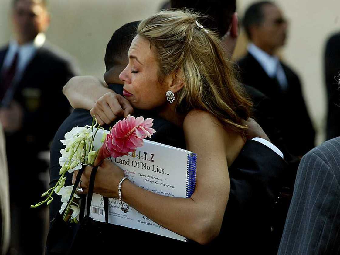 Tanya Hijazi gets a hug during Rick James' burial Tanya Hijazi gets a hug during Rick James' burial