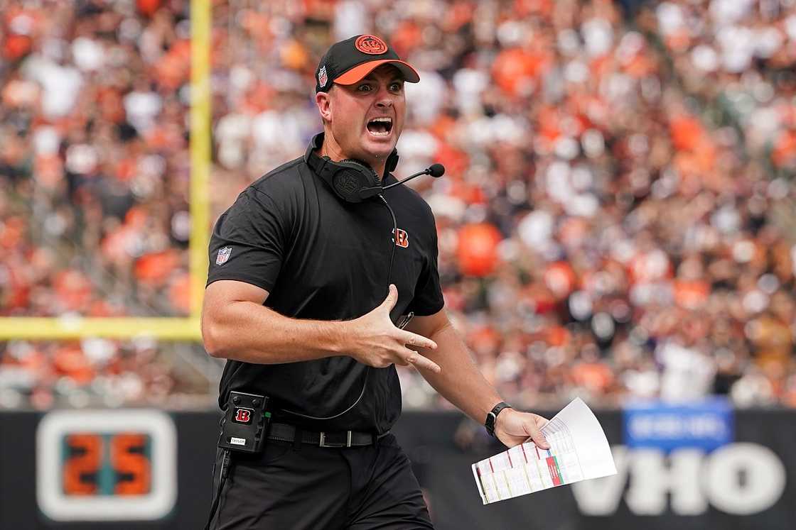 Zac Taylor gestures and shouts during a football match.