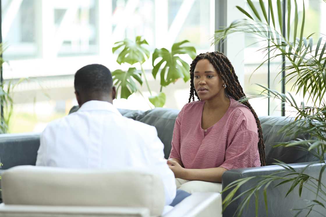 A lady is talking to a doctor A lady is talking to a doctor