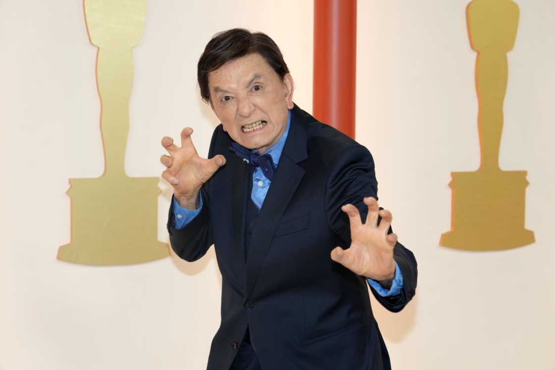 James Hong poses with his signature hands move at the 95th Annual Academy Awards