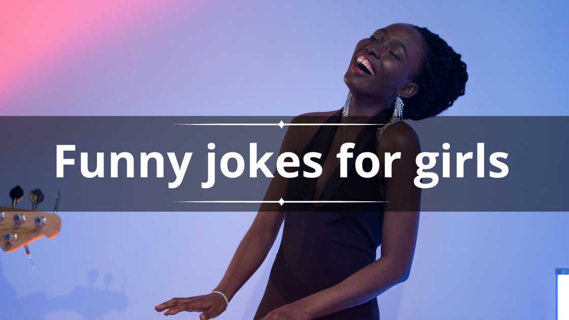 A woman wearing a black dress is pictured laughing