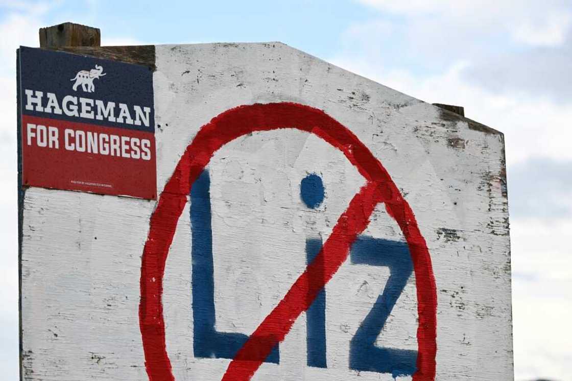 A hand painted sign stands in opposition to US Representative Liz Cheney (R-WY) displayed on the side of a road along with support of her Republican primary opponent Harriet Hageman in Casper, Wyoming A hand painted sign stands in opposition to US Representative Liz Cheney (R-WY) displayed on the side of a road along with support of her Republican primary opponent Harriet Hageman in Casper, Wyoming