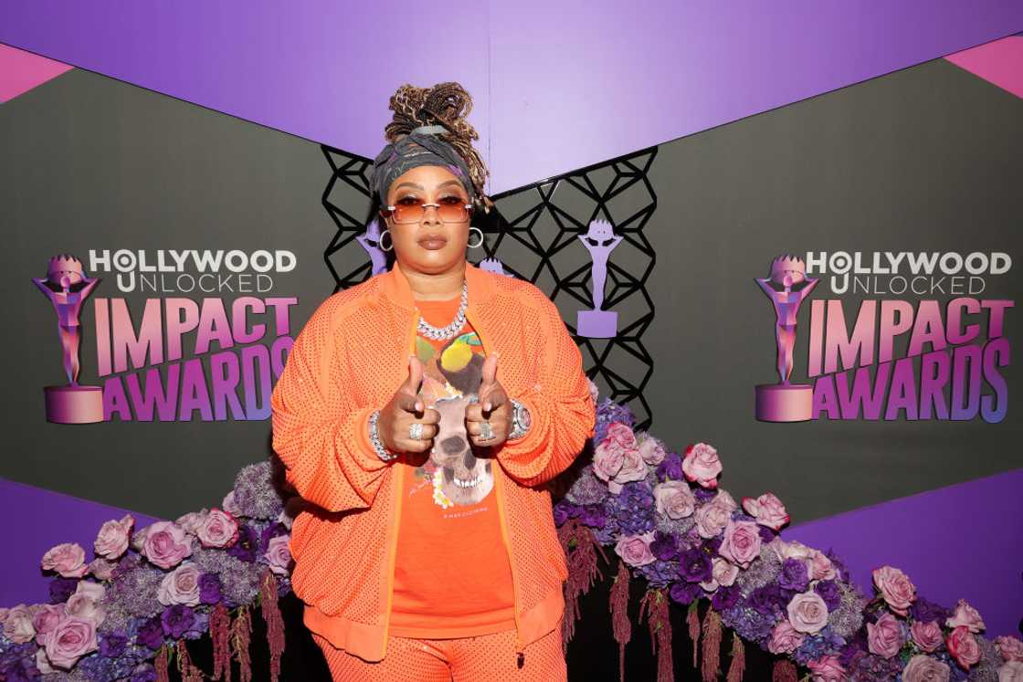 Da Brat attends pose in orange at The Beverly Hilton Da Brat attends pose in orange at The Beverly Hilton