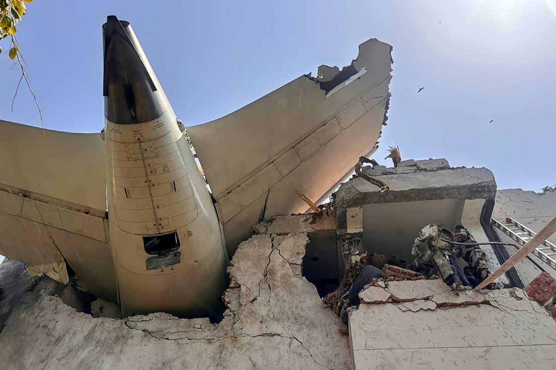 The back of the Air India plane after it crashed in a residential area in Ahmedabad, in a photo published by India's Central Industrial Security Force The back of the Air India plane after it crashed in a residential area in Ahmedabad, in a photo published by India's Central Industrial Security Force
