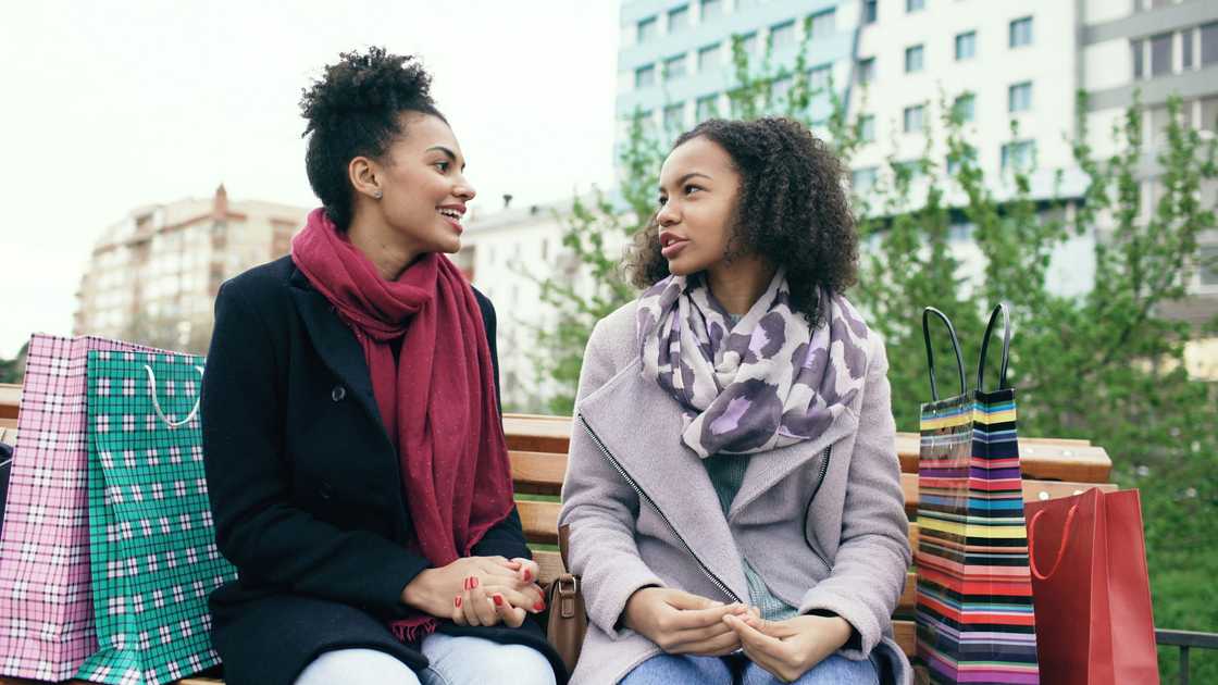 Two women talking outdoors Two women talking outdoors