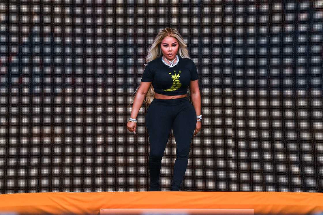 Lil' Kim performs onstage during the Lovers & Friends music festival Lil' Kim performs onstage during the Lovers & Friends music festival