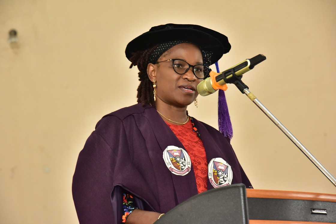 Professor Adenike Oladiji speaking on a podium Professor Adenike Oladiji speaking on a podium