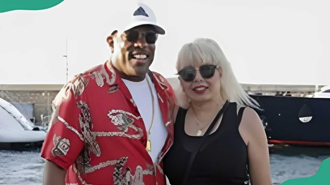 Charlie Wilson and Mahin Tat pose for a photo