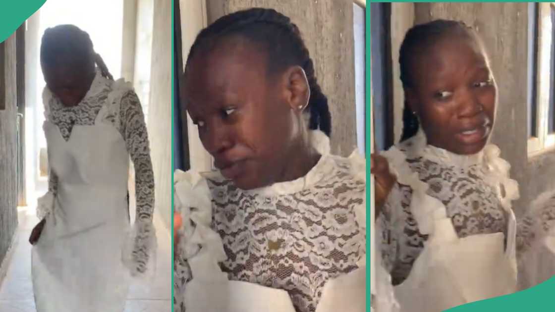 Lady cries after seeing dress made for her by a tailor.