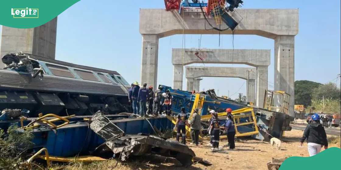 Emergency workers attend to injured passengers at the scene of the Thailand train crash.