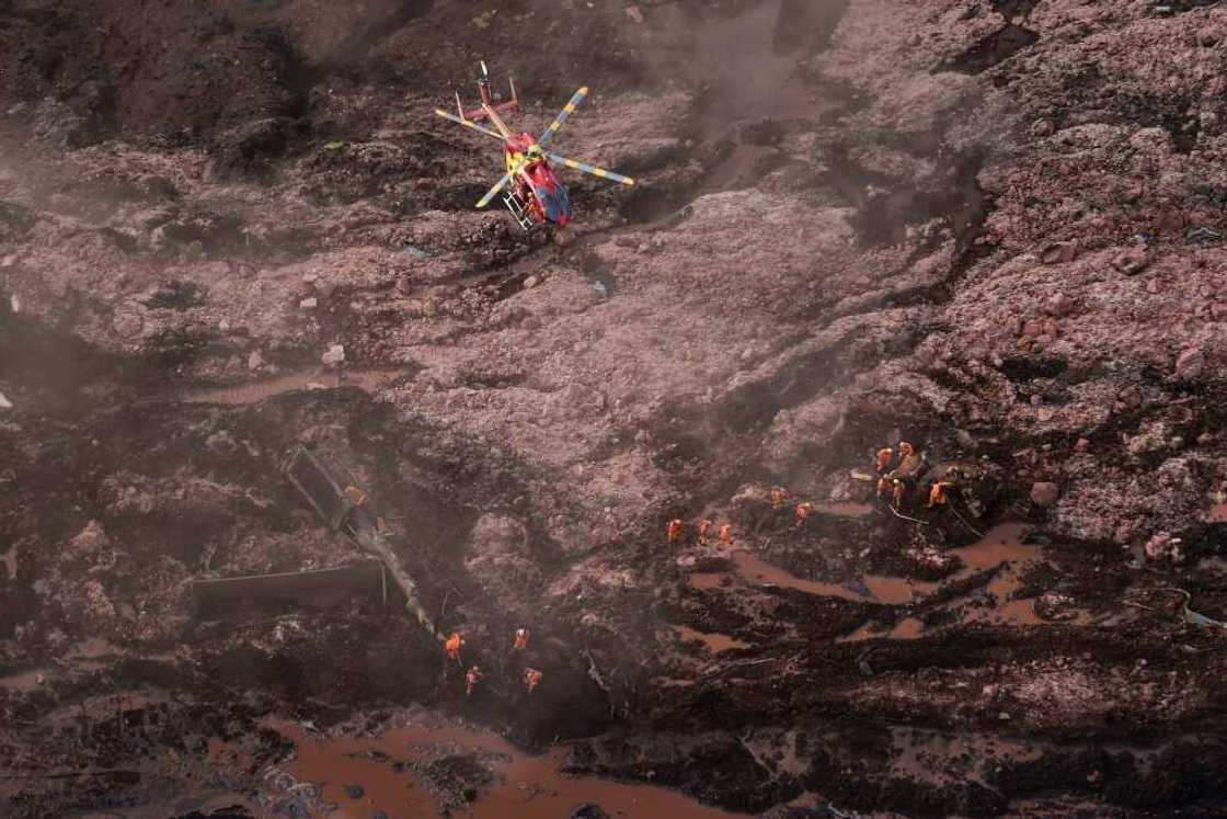 Rescue workers searching for victims after the spill Rescue workers searching for victims after the spill