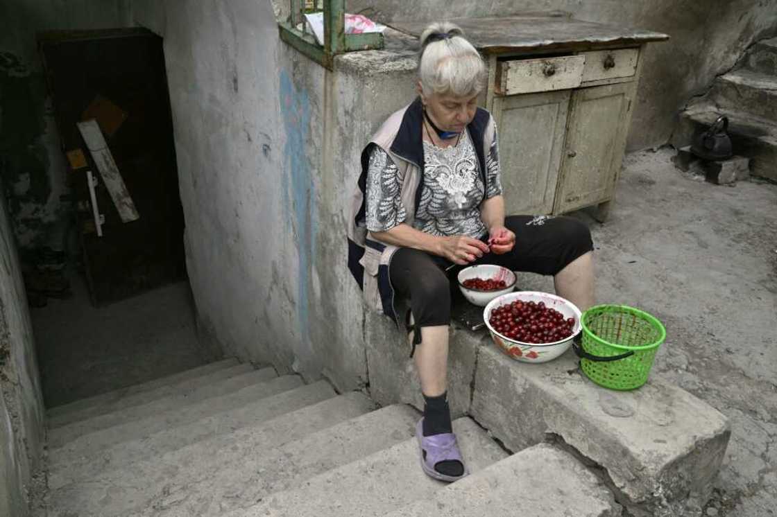 Three months stuck in a cellar: Lyudmila pits cherries outside her basement in Siversk as Russian forces draw closer Three months stuck in a cellar: Lyudmila pits cherries outside her basement in Siversk as Russian forces draw closer