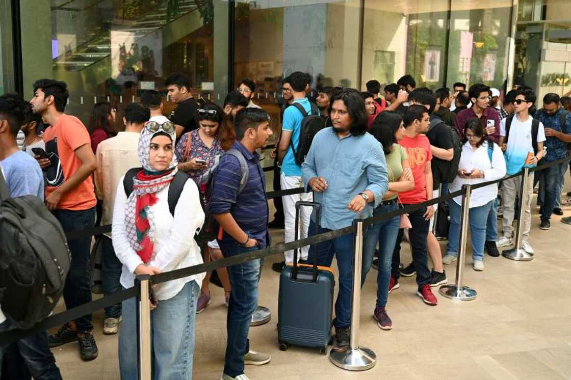 People queue outside India's first Apple store ahead of its Tuesday opening in Mumbai People queue outside India's first Apple store ahead of its Tuesday opening in Mumbai