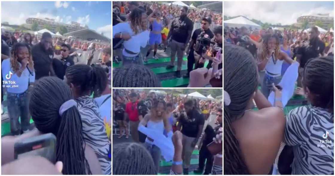 Asake removes cloth to give female fan who impressed him. Asake removes cloth to give female fan who impressed him.