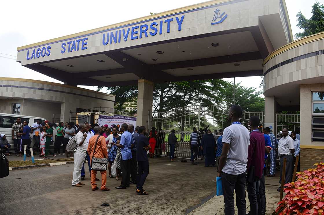 Students and lecturers of Lagos State University wait out the school gate Students and lecturers of Lagos State University wait out the school gate