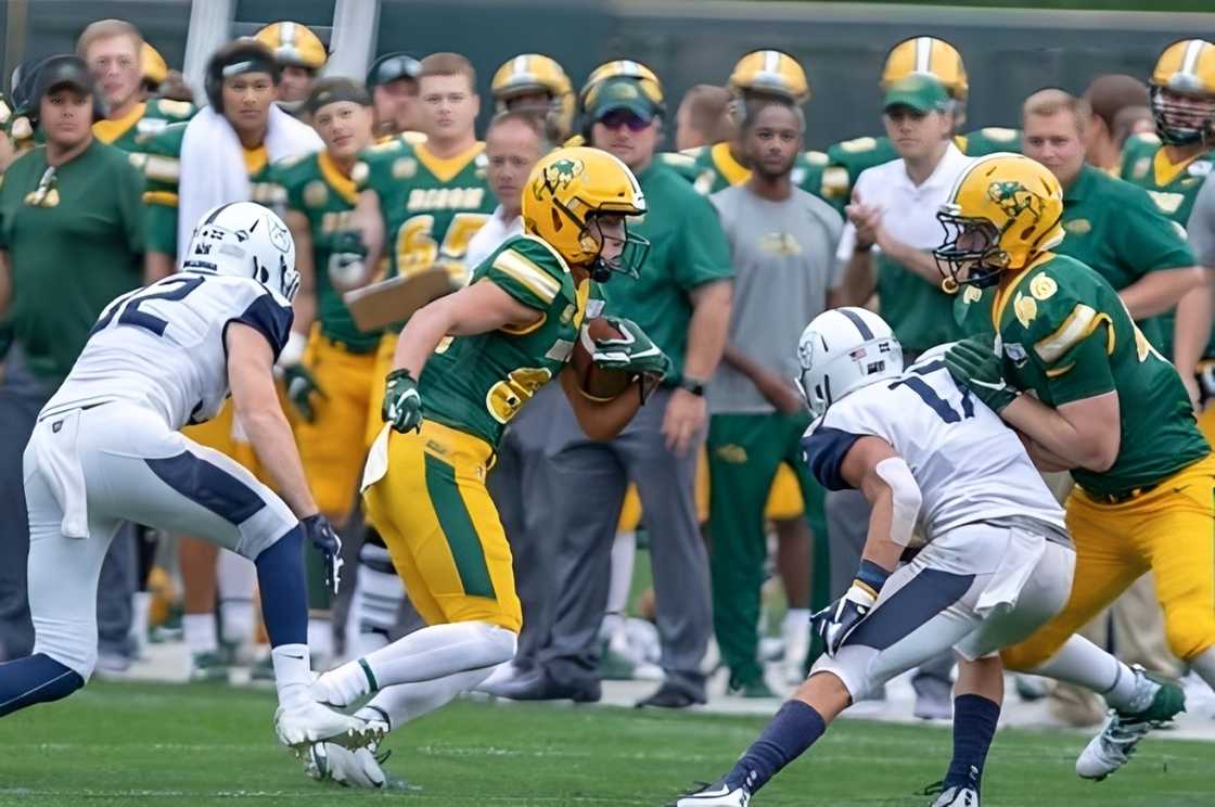 Andy Voyen runs with the ball during a football match. Andy Voyen runs with the ball during a football match.