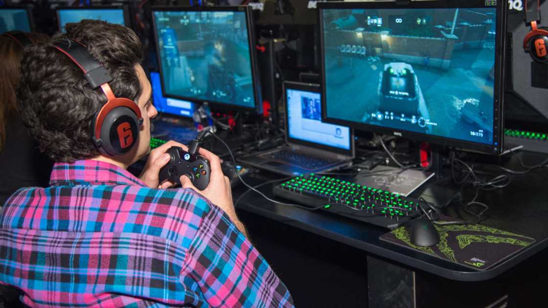 Ben Schwartz playing Tom Clancy's Rainbow Six Siege during the game's launch party Ben Schwartz playing Tom Clancy's Rainbow Six Siege during the game's launch party