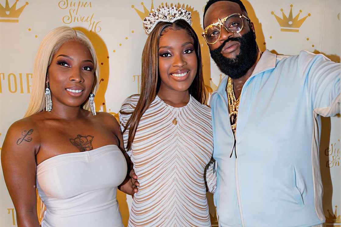 Lastonia Leviston, her daughter Toie Roberts and Rick Ross pose during her birthday celebration.