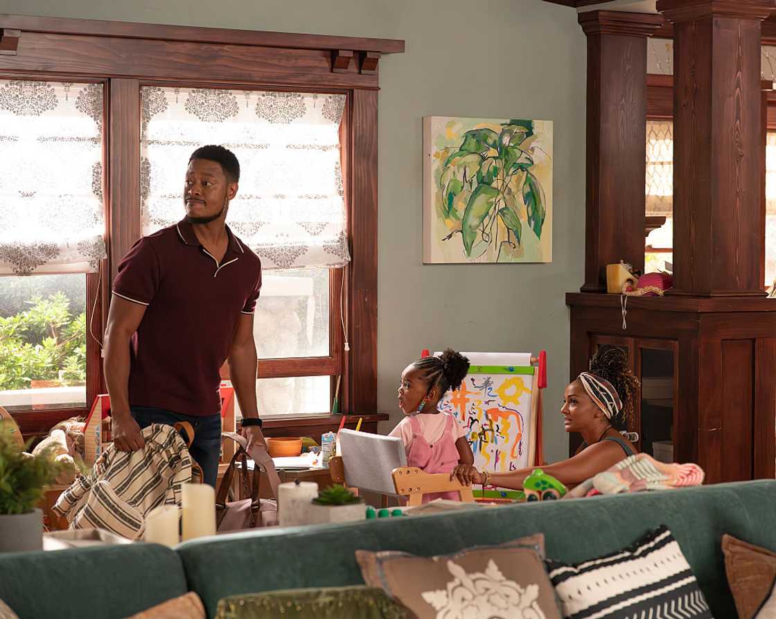 Man with his family in the living room