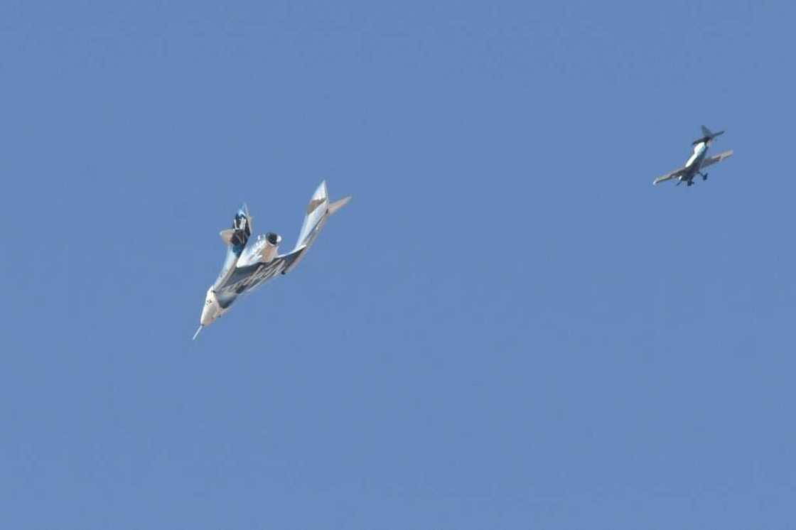 The Virgin Galactic SpaceShipTwo spaceplane Unity and mothership separate as they fly way above Spaceport America in New Mexico in July 2021 on the way to the cosmos