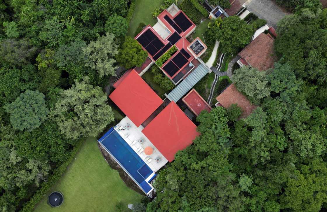 Senior citizens have built houses on a plot of land surrounded by forests and mountains in central Mexico