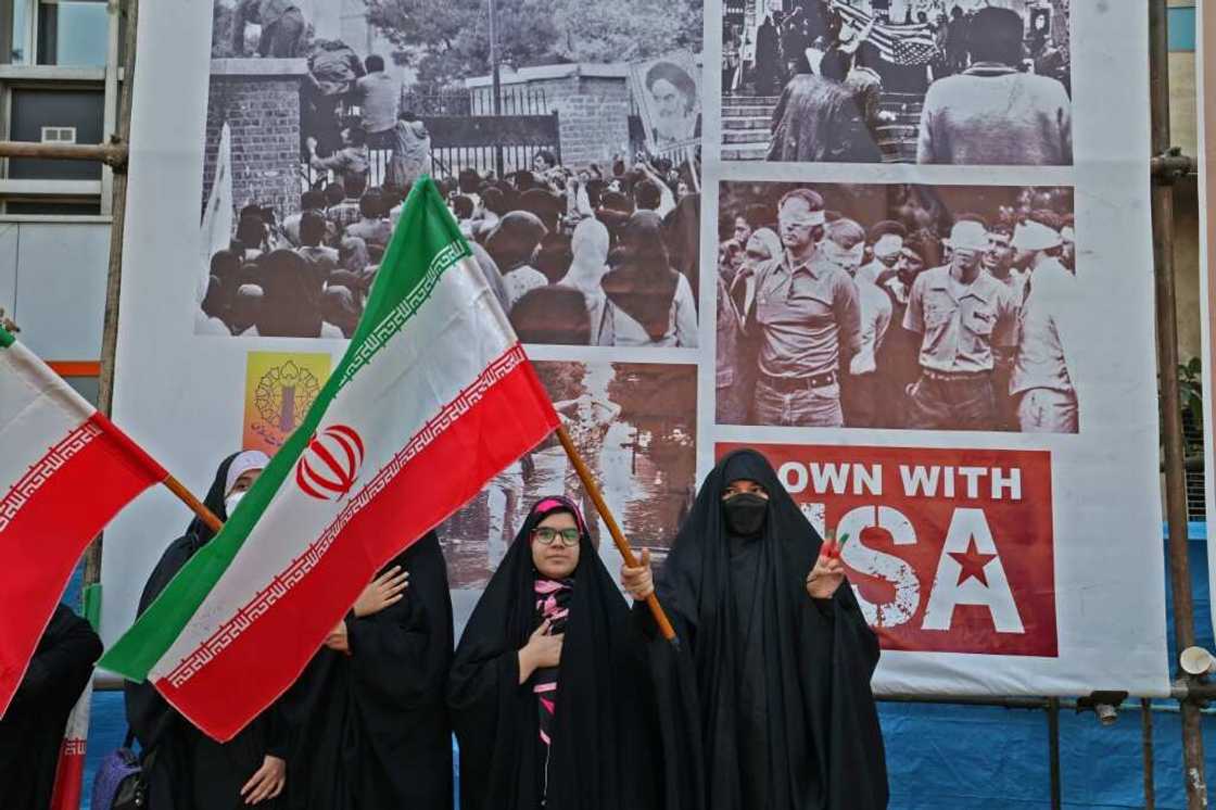 Iranians have also mobilised in support of the regime, including in Tehran outside the former US embassy on Friday, a day that marked the 43th anniversary of the start of the Iran hostage crisis Iranians have also mobilised in support of the regime, including in Tehran outside the former US embassy on Friday, a day that marked the 43th anniversary of the start of the Iran hostage crisis