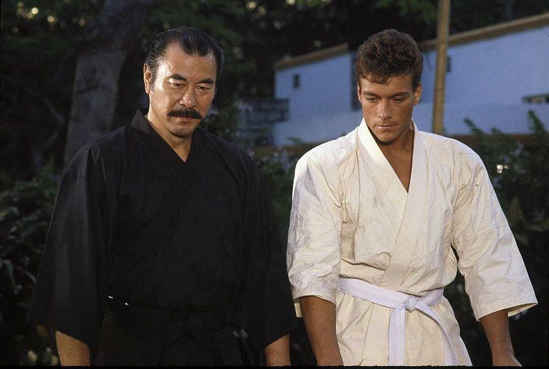Roy Chiao (L) and Jean Claud Van Damme act in a scene in Bloodsport Roy Chiao (L) and Jean Claud Van Damme act in a scene in Bloodsport