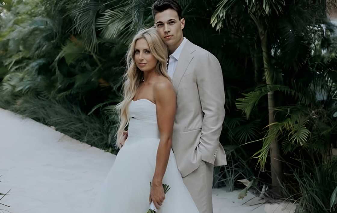 Andy and Ally Voyen pose during their wedding Andy and Ally Voyen pose during their wedding