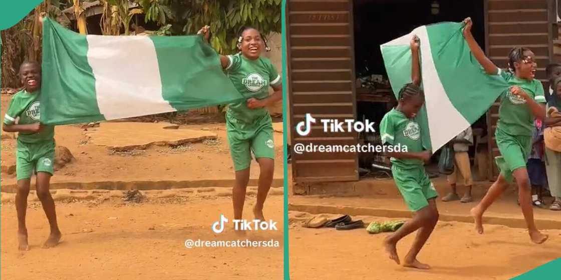 Kids dancing with a Nigerian flag.