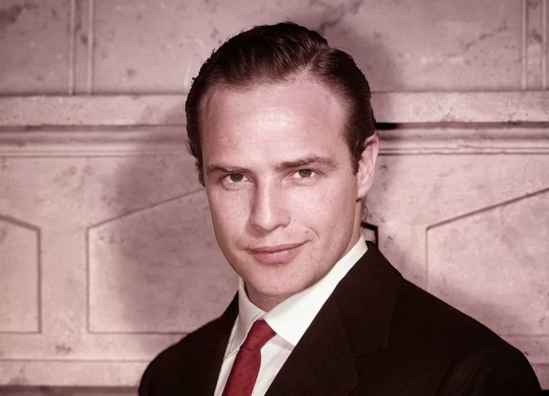 Marlon Brando posing for a photo Marlon Brando posing for a photo