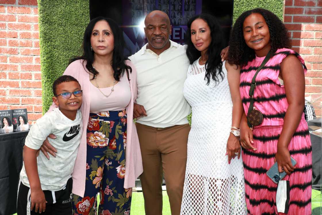 Mike Tyson and his wife Kiki Tyson, their children (Morocco and Milan) and his mother-in-law at an event. Mike Tyson and his wife Kiki Tyson, their children (Morocco and Milan) and his mother-in-law at an event.