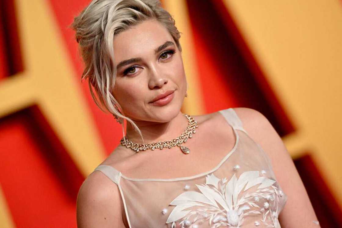 Florence Pugh in a white sheer dress at the 2024 Vanity Fair Oscar Party