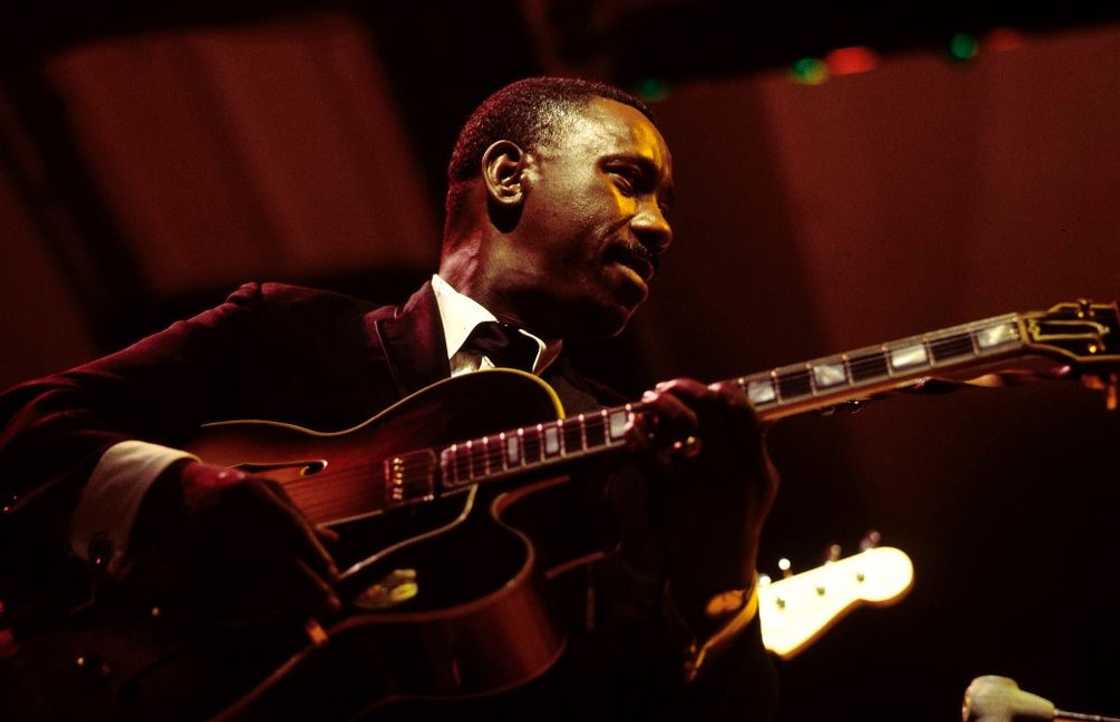 Wes Montgomery playing guitar on stage at the Newport Jazz Festival