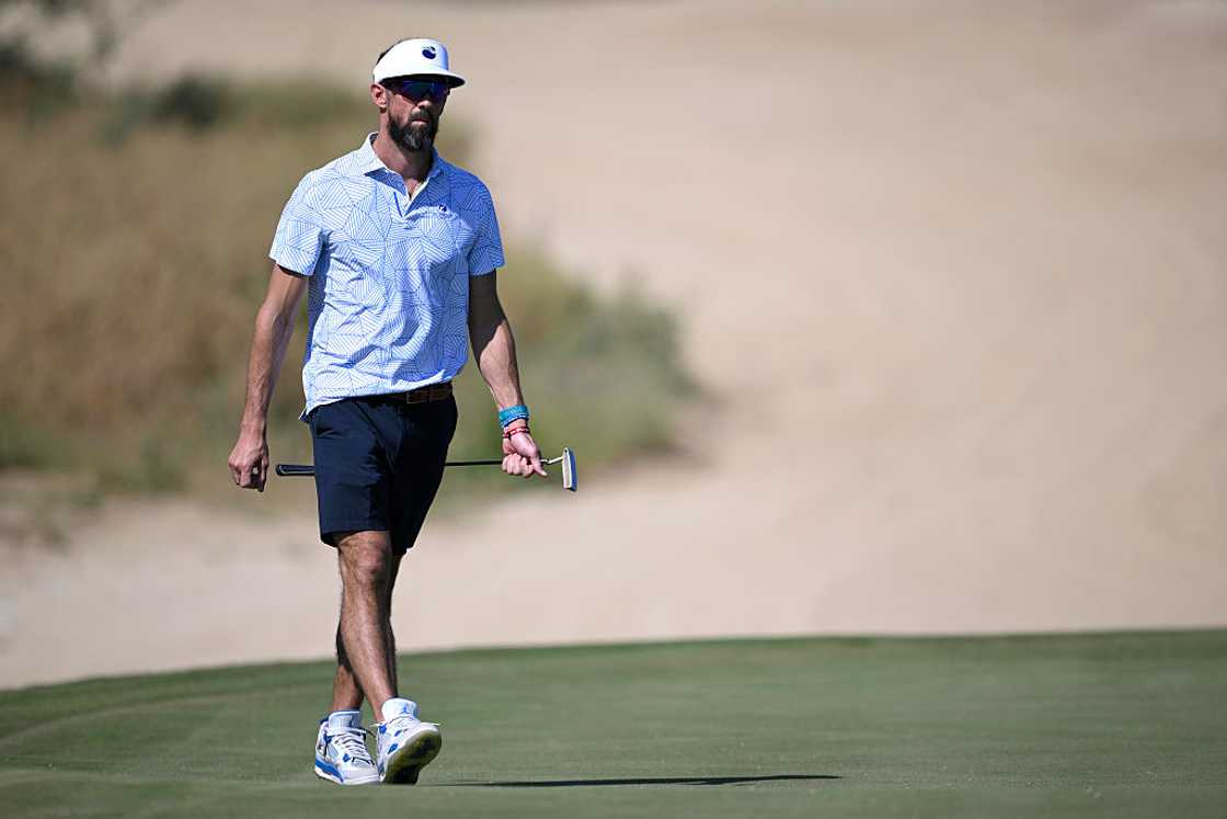 Michael Phelps walks on a golf course Michael Phelps walks on a golf course