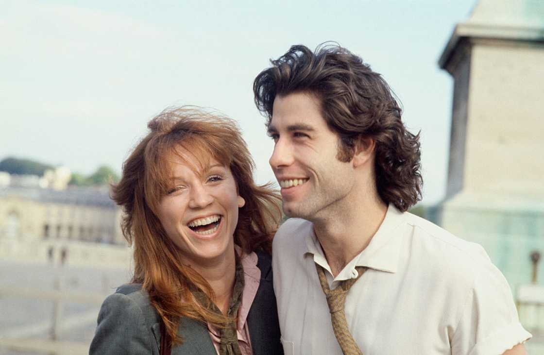 John Travolta and Marilu Henner on the esplanade of Versailles castle.