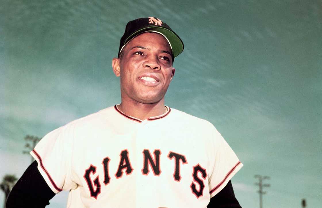 Willie Mays of the New York Giants posing for a photo Willie Mays of the New York Giants posing for a photo