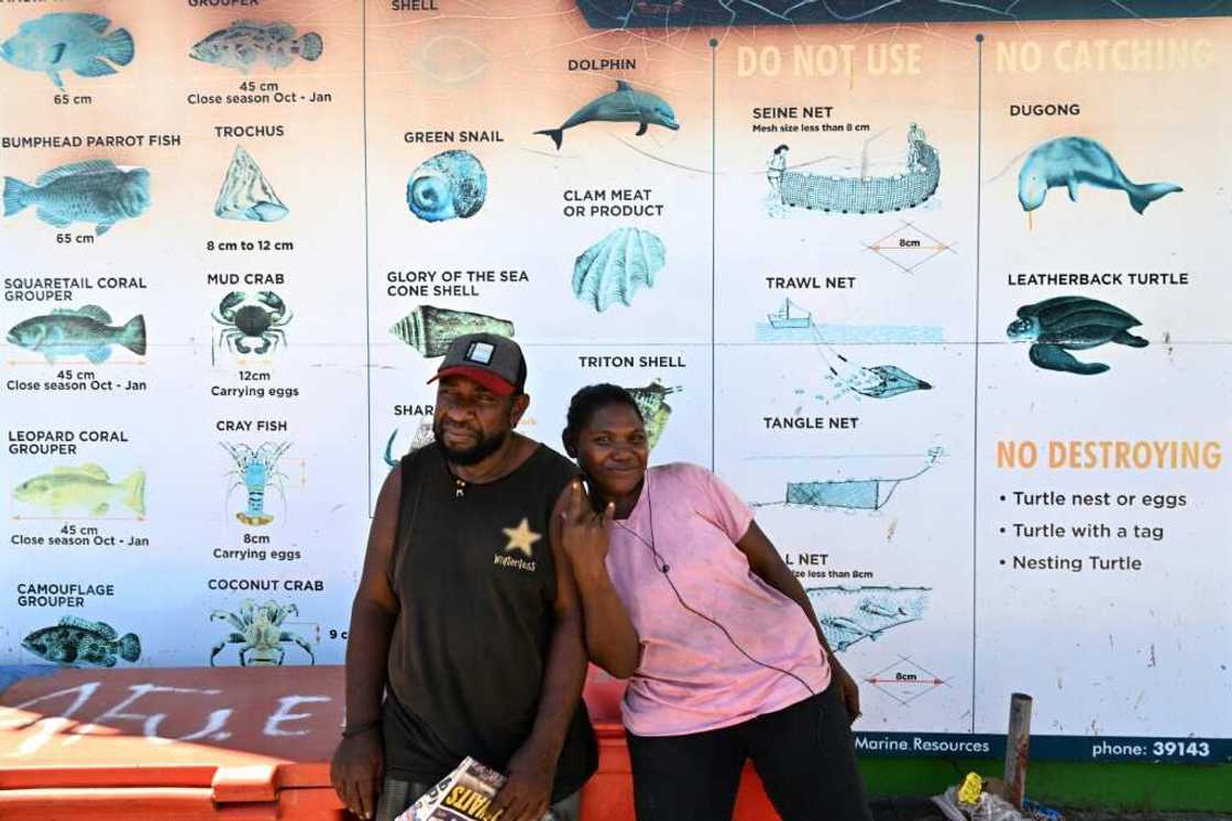 A faded sign at Honiara's seaside market warns against the live wildlife trade, singling out dolphins as a 'no sell' species A faded sign at Honiara's seaside market warns against the live wildlife trade, singling out dolphins as a 'no sell' species