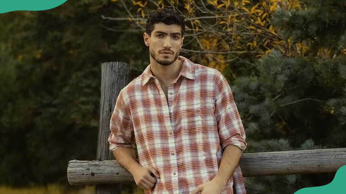 Charlie Georgiou poses for a photo
