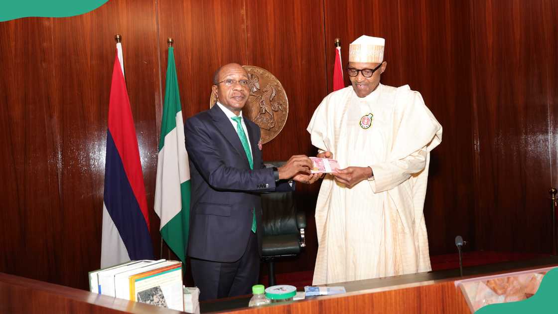 Godwin Emefiele and H.E. Muhammadu Buhari at an office