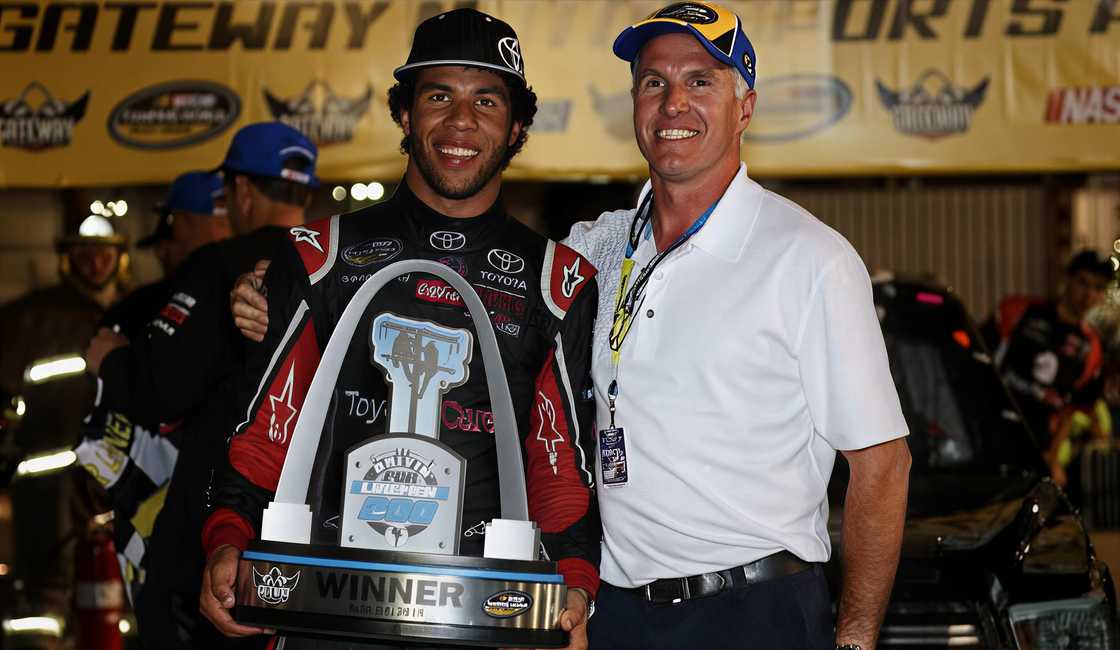 Bubba Wallace poses with his father, Darrell Wallace Jr. after winning a race event Bubba Wallace poses with his father, Darrell Wallace Jr. after winning a race event