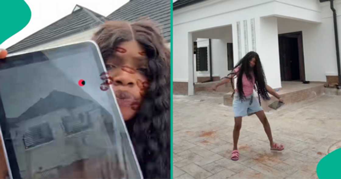 Nigerian lady flaunts her new bungalow, dances with joy. Nigerian lady flaunts her new bungalow, dances with joy.