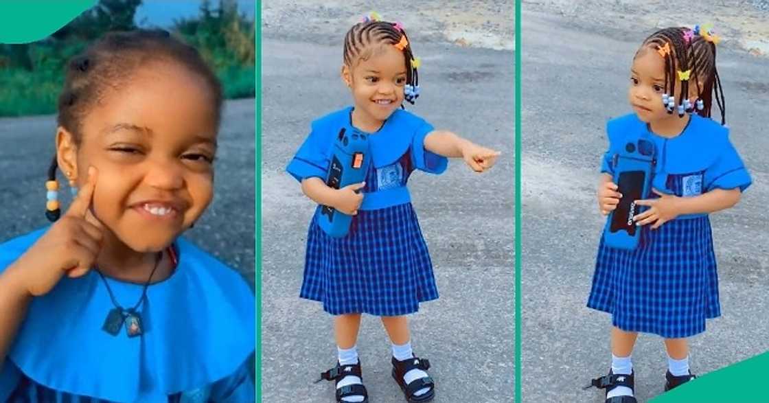 Cute little girl in school uniform trends online