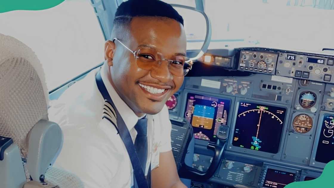 A pilot smiles inside a plane's cockpit