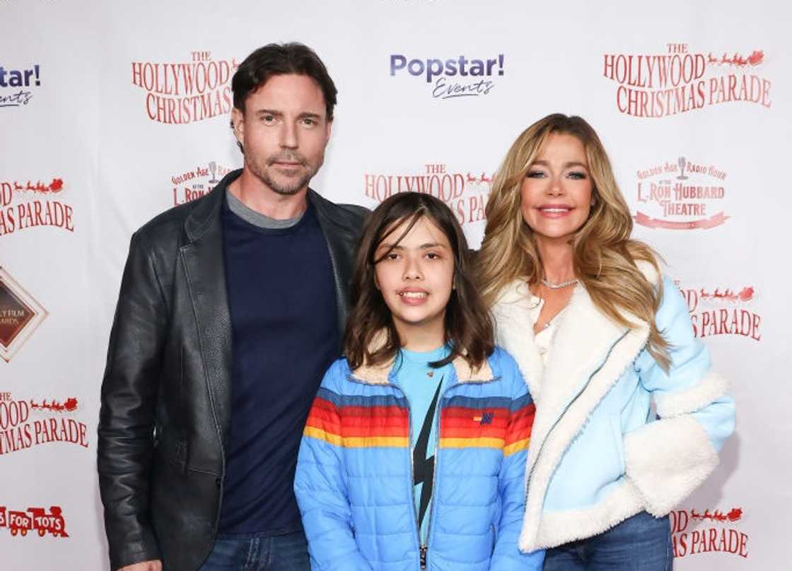 Aaron Phypers, Eloise Joni Richards and Denise Richards (L-R) attend the 91st anniversary of the Hollywood Christmas Parade