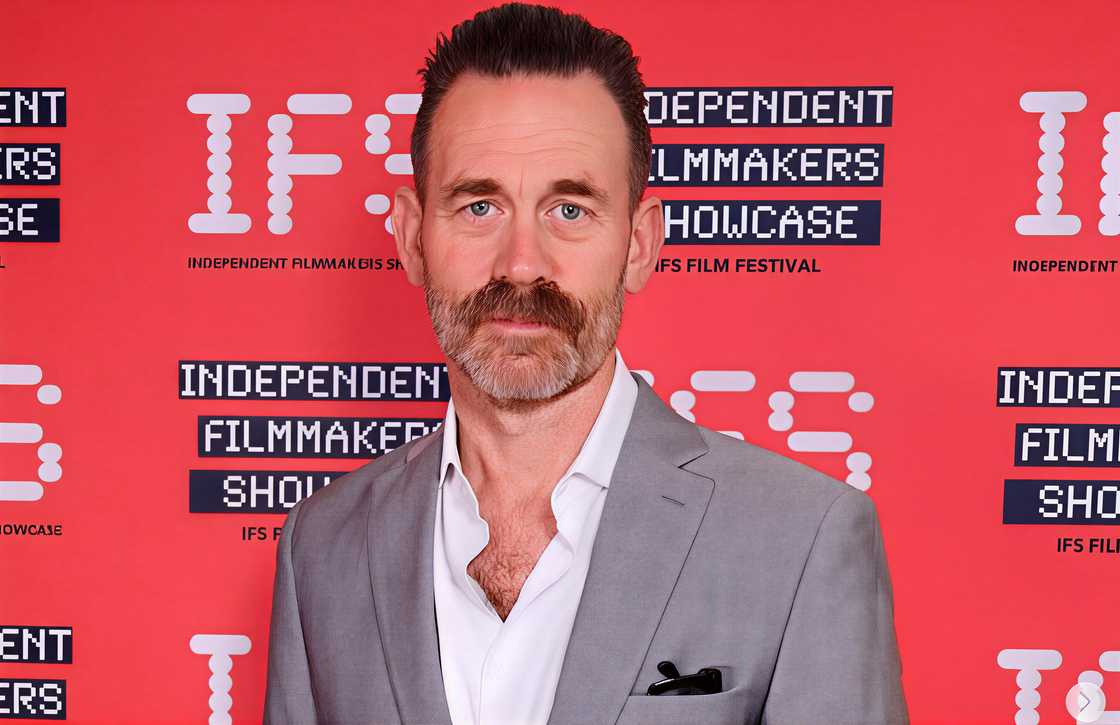 P.J. King poses on the red carpet of at an IFS Film Festival
