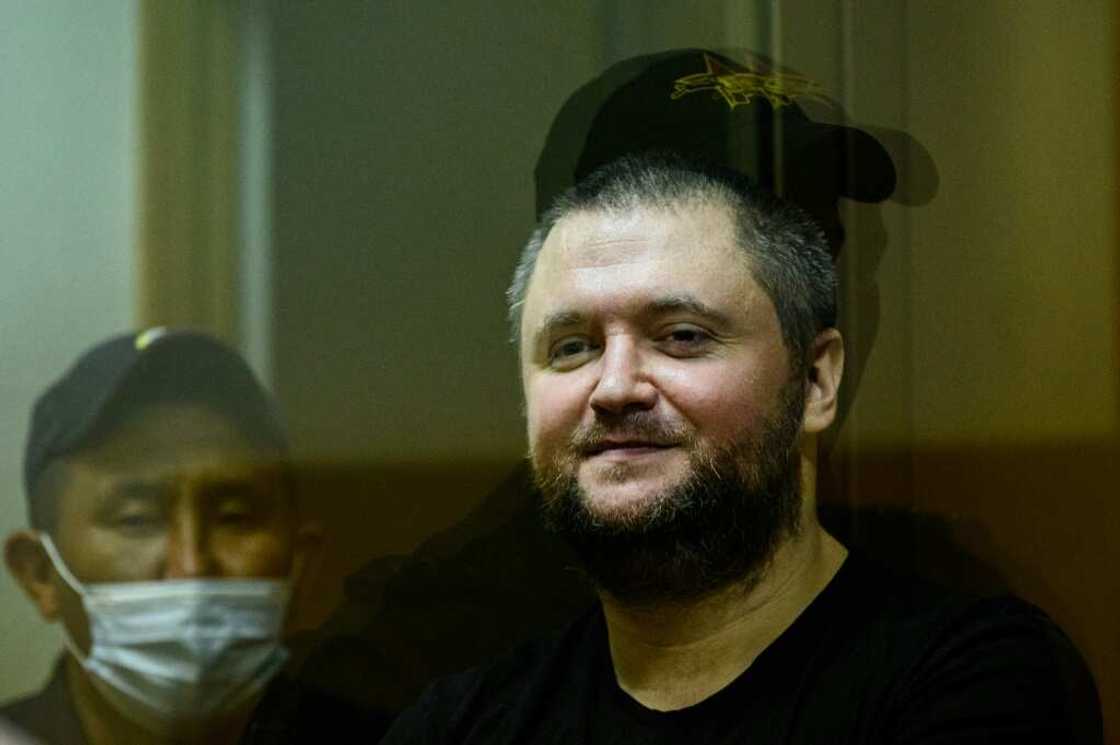 Former Russian policeman Vladimir Vorontsov, seen here in court in 2020, was jailed on Tuesday
, stands inside a defendants' cage during a court hearing in Moscow on July 2, 2020.Supporters of the 35-year-old, with blue eyes and a stocky build, say that the real reason for his arrest is his Police Ombudsman project, a series of linked social media accounts dedicated to protecting police officers' rights and exposing abuse by their higher-ups. His case has sparked a rare public outcry among police, a key pillar of President Vladimir Putin's rule, that could eventually spell trouble for the Kremlin, observers say. Former Russian policeman Vladimir Vorontsov, seen here in court in 2020, was jailed on Tuesday
, stands inside a defendants' cage during a court hearing in Moscow on July 2, 2020.Supporters of the 35-year-old, with blue eyes and a stocky build, say that the real reason for his arrest is his Police Ombudsman project, a series of linked social media accounts dedicated to protecting police officers' rights and exposing abuse by their higher-ups. His case has sparked a rare public outcry among police, a key pillar of President Vladimir Putin's rule, that could eventually spell trouble for the Kremlin, observers say.