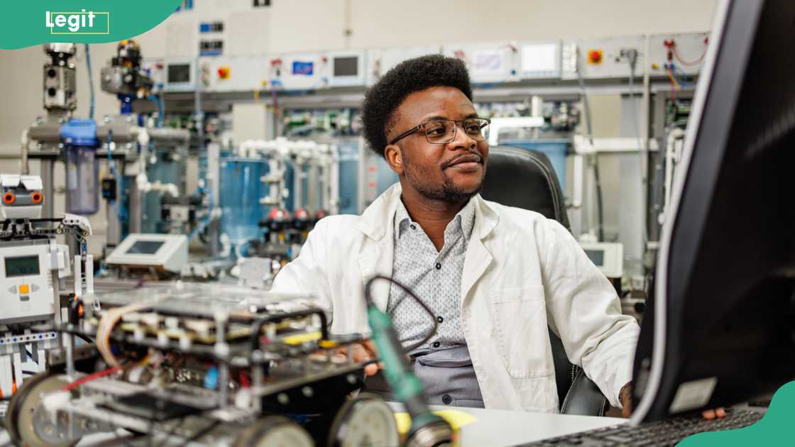 A male electronic engineer working on a desktop computer.