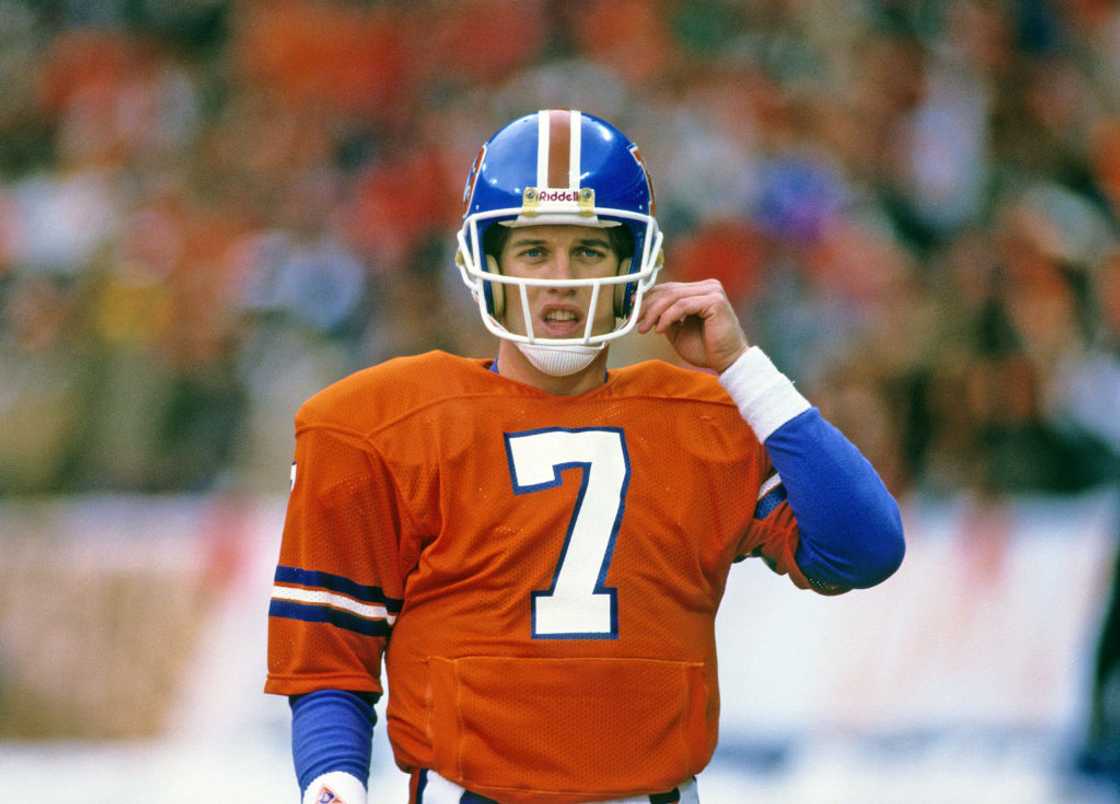 John Elway of the Denver Broncos looks on from the field John Elway of the Denver Broncos looks on from the field